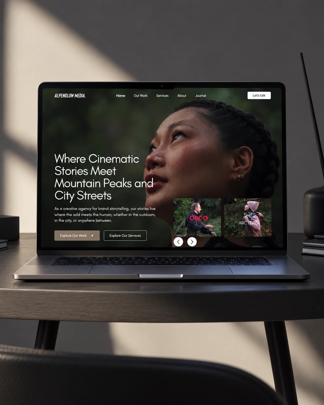 Alpenglow Media homepage on a laptop: cinematic hero for mountain and city brand films