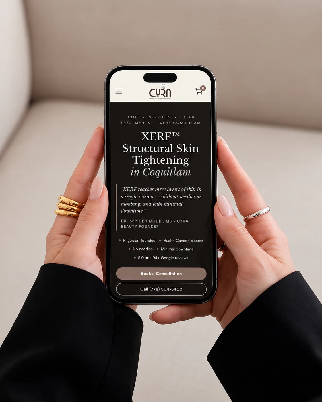 Cyra Beauty XERF skin tightening treatment page on a phone, held in two hands