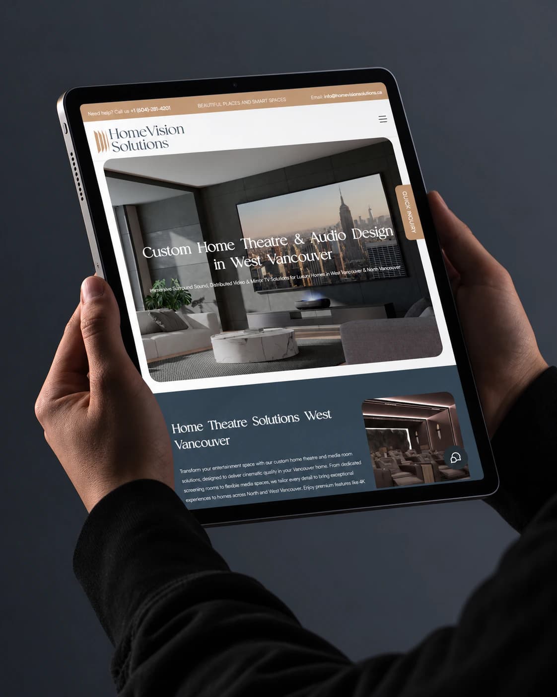 Home Vision Solutions West Vancouver home theatre and audio page on a tablet, held in two hands