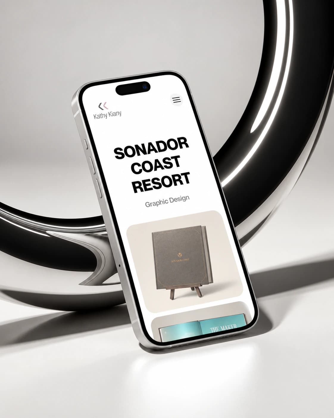 Kathy Kiany Sonador Coast Resort project page on a phone, on a chrome ring stand