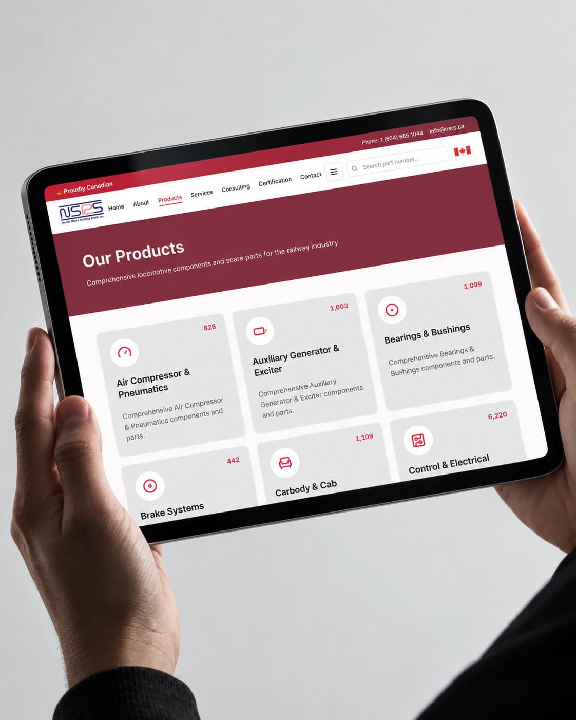 NSRS Our Products page on a tablet, held in two hands