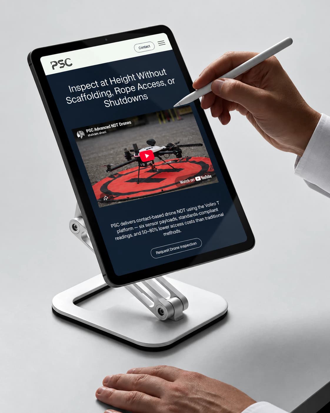 PSC drone NDT page on a tablet on a stand, with a stylus: inspect at height without scaffolding